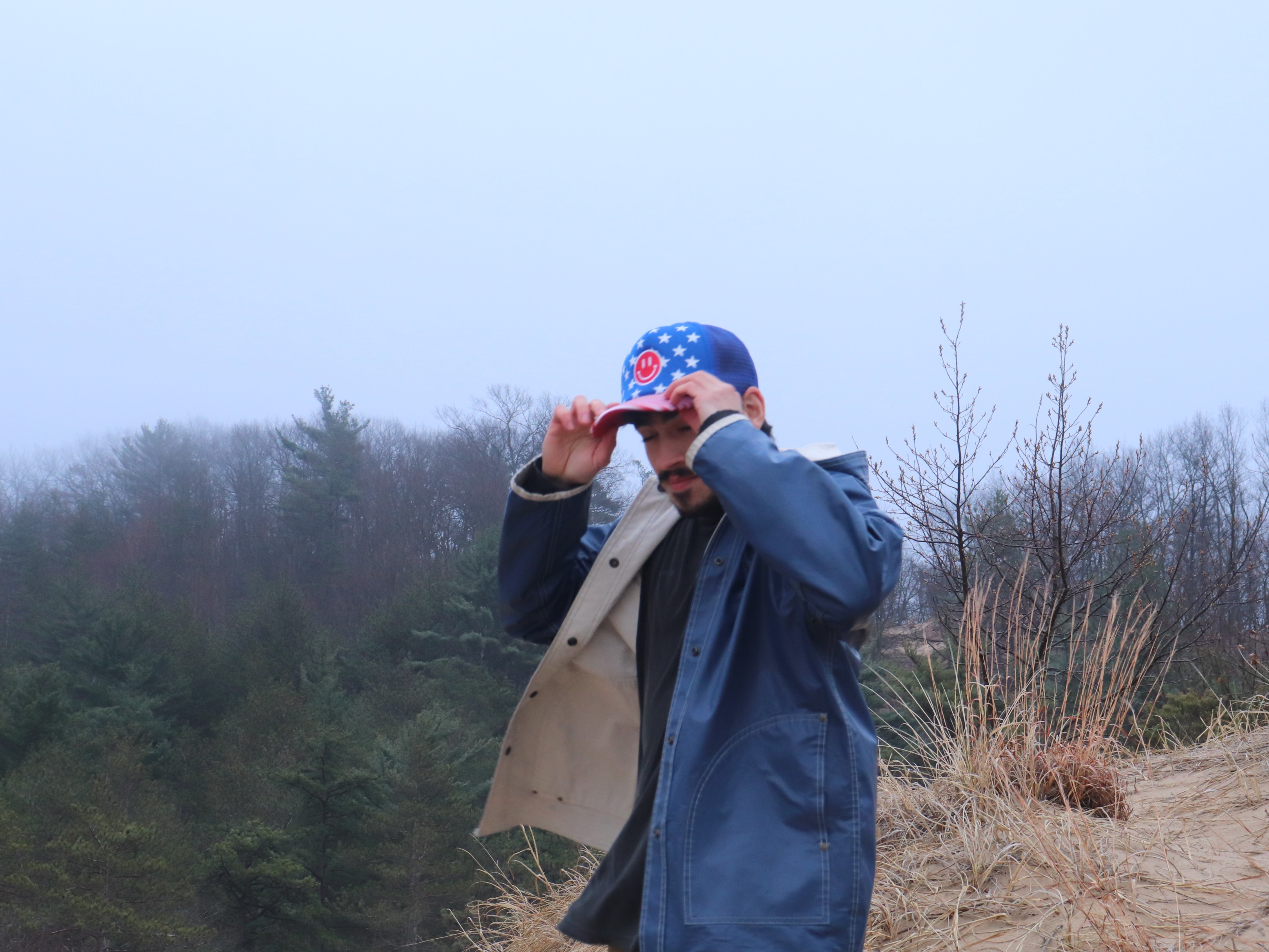 Tofu Tony at a Lake Michigan beach with American flag hat